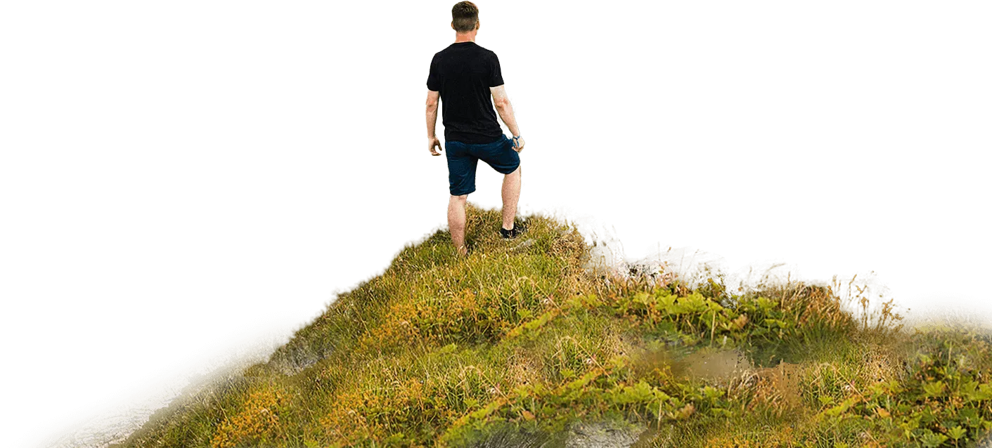A person standing on top of a mountain