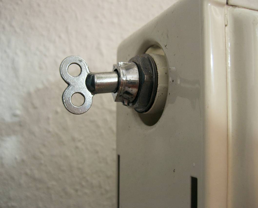 Bleed key inserted into radiator