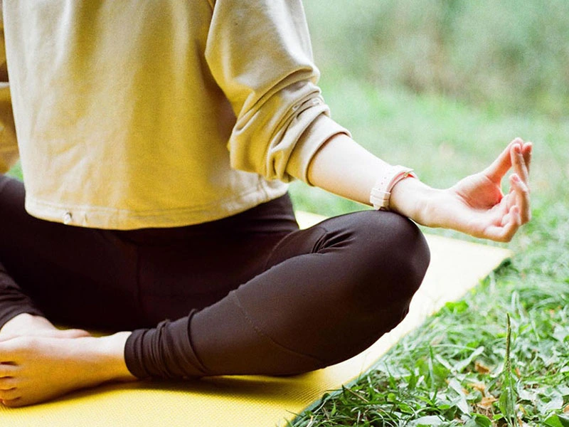 Person meditating to help with stress