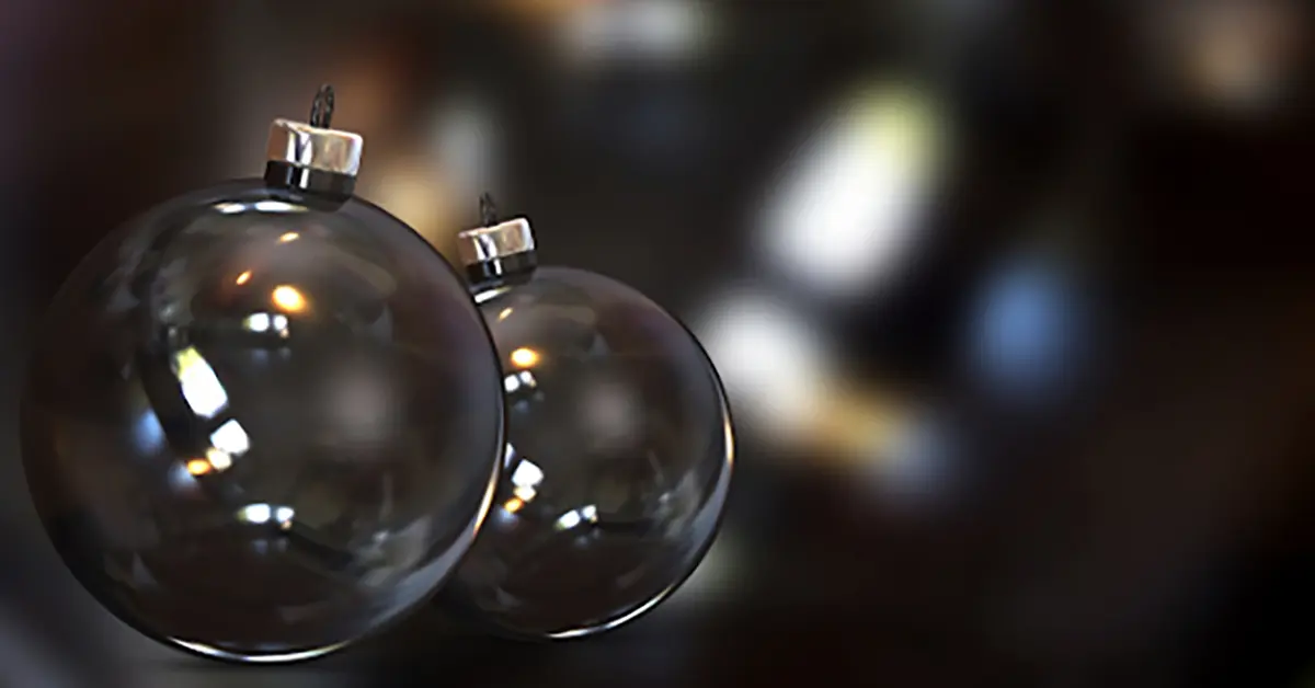 Two Christmas ornaments in air