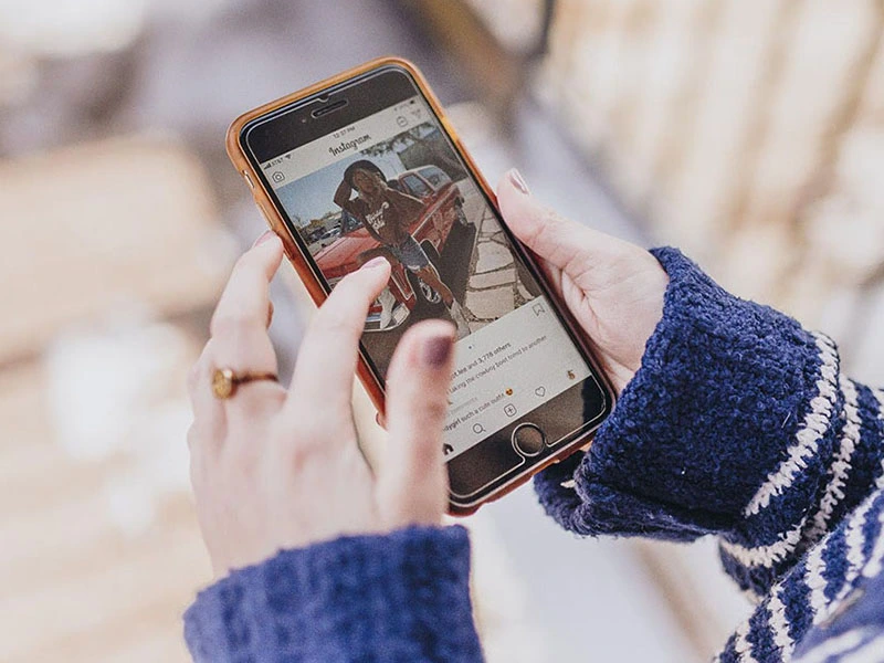 Teen looking at an influencers instagram photo