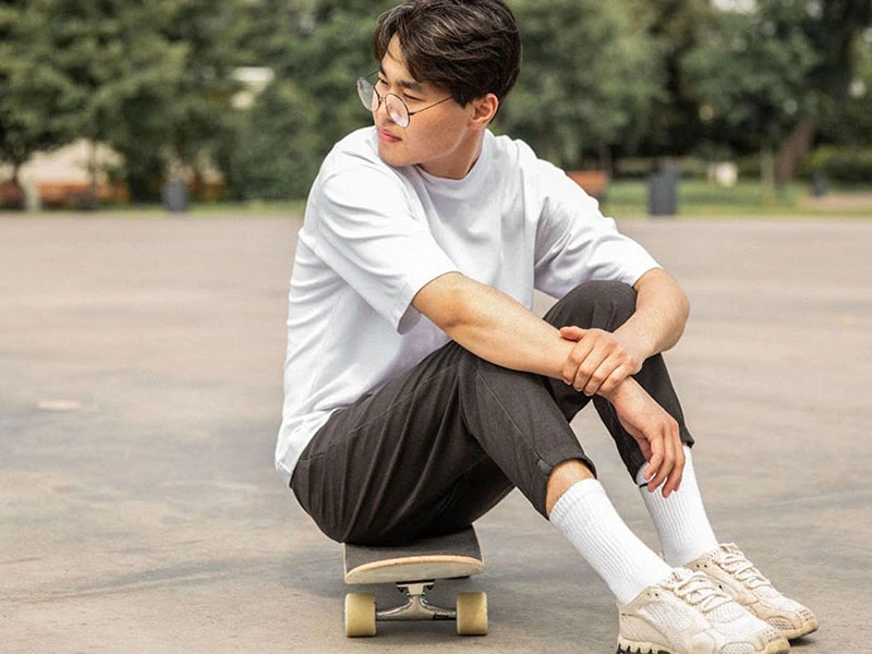 teen sitting on skateboard after a panic attack