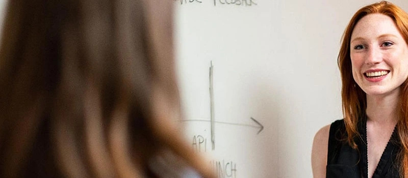 Student talking to teacher about mental health issues