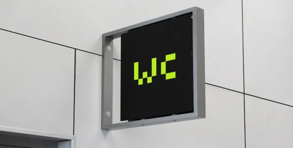 Mockup av et WC skilt for Axdata