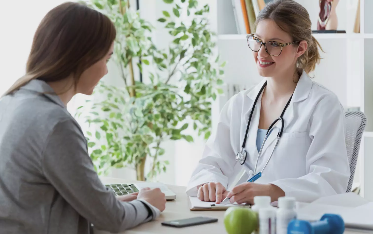 a person talking to a doctor