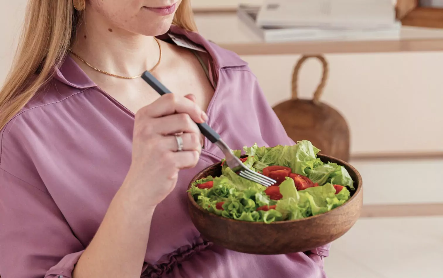 a person eating a salad