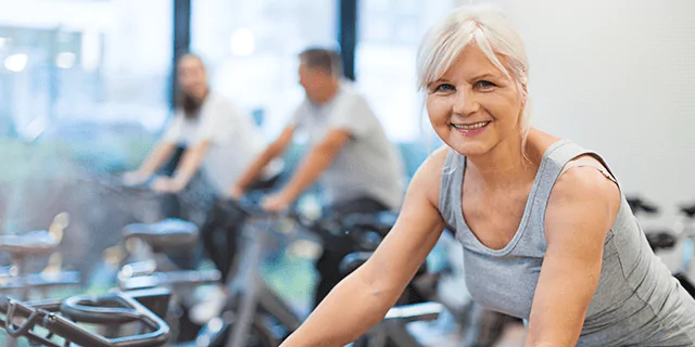 a person cycling indoors