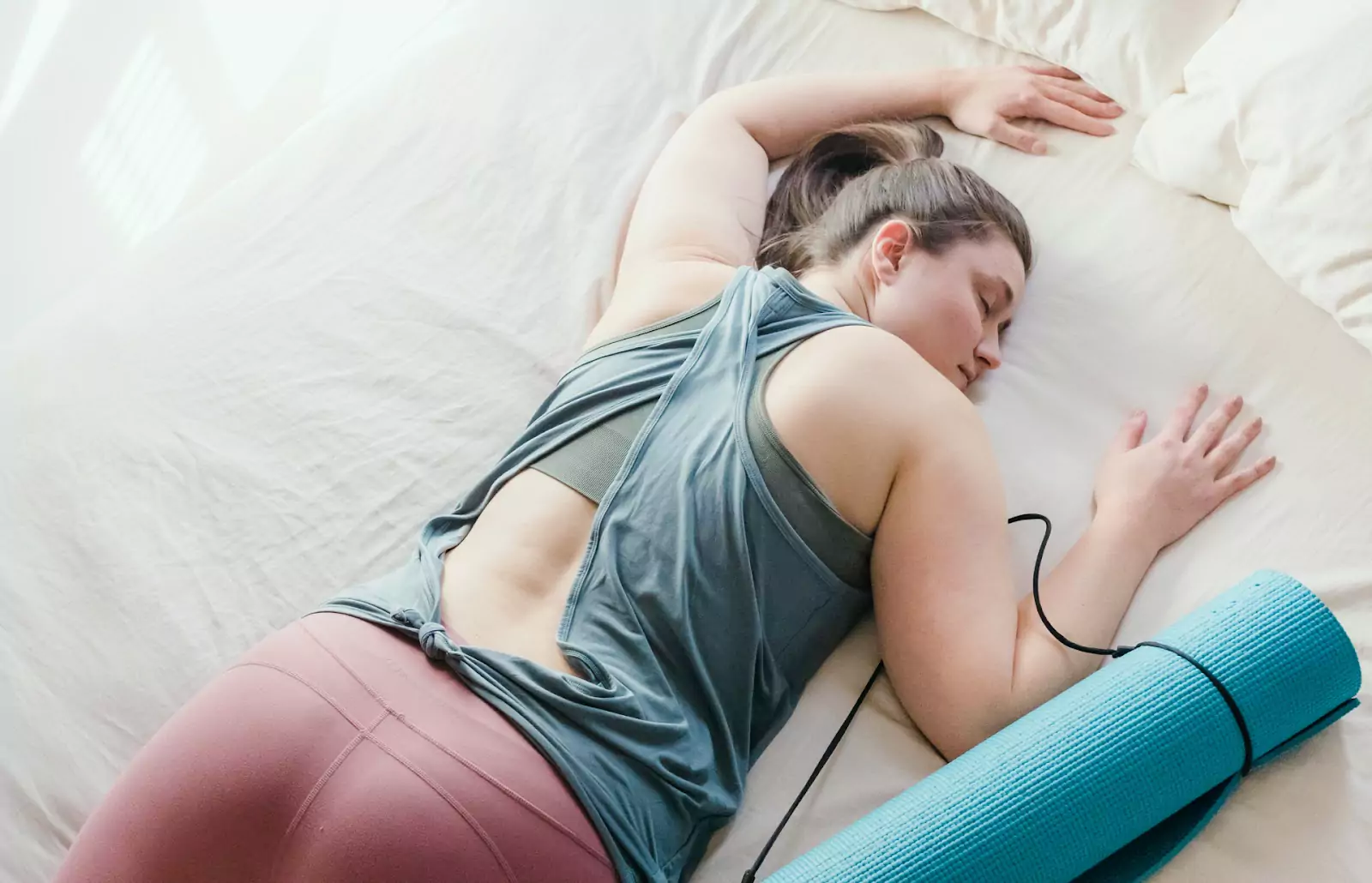a person laying on a bed