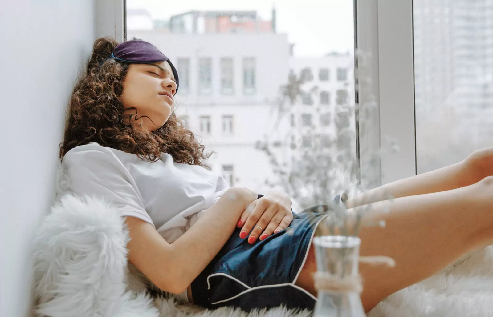 a person having a nap near the window