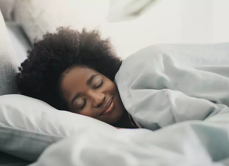 Woman sleeping on bed