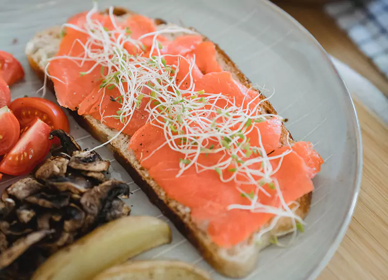 a plate of salmon toast