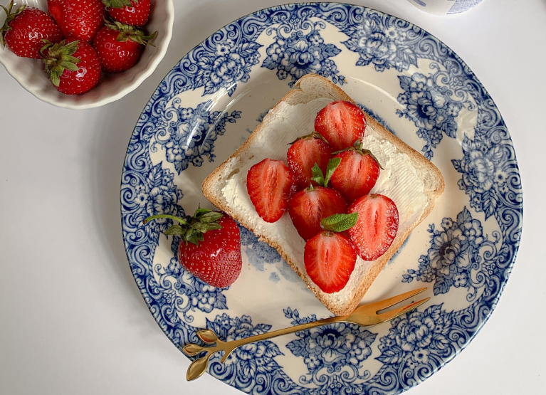 a plate with toast and strawberries