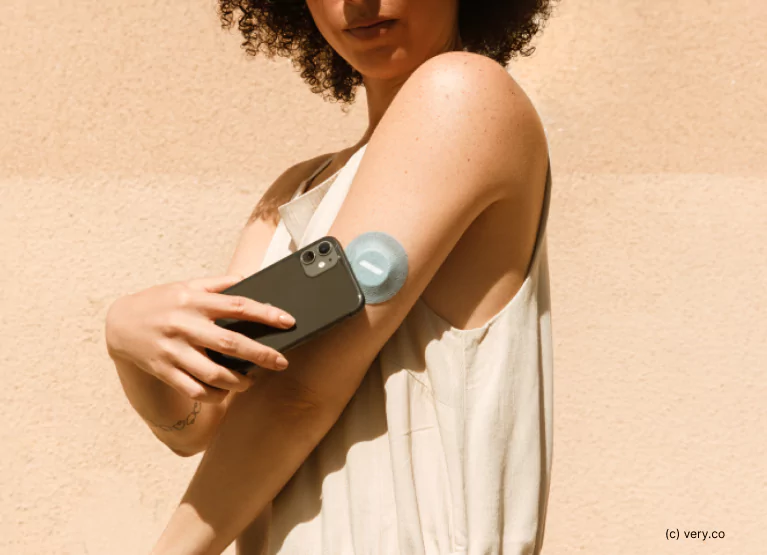 a woman wearing a Veri CGM