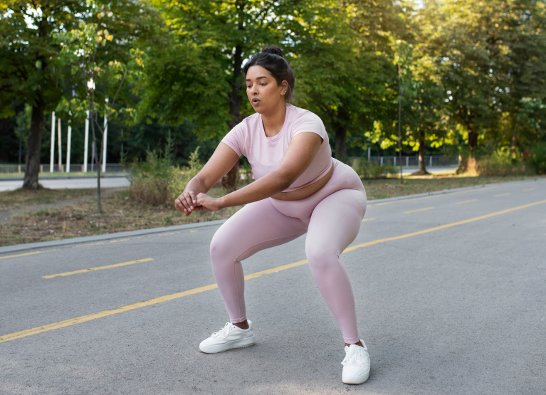 Woman stretching in park