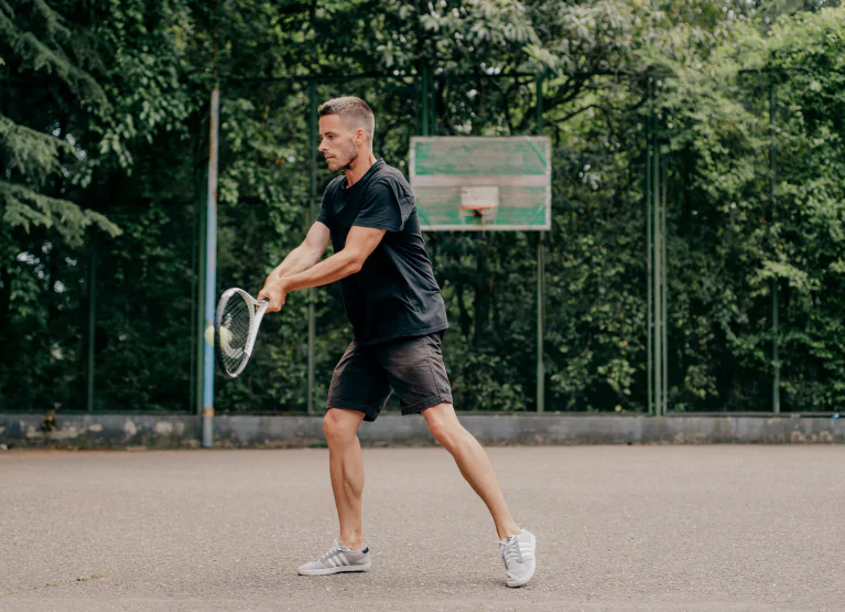 a man playing tennis