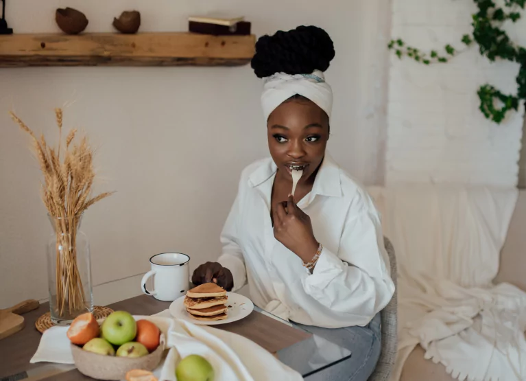 a girl eating breakfast