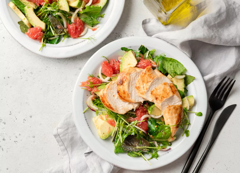 a salad with grilled chicken