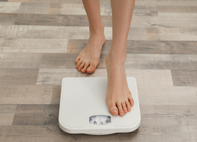 Person stepping on scale