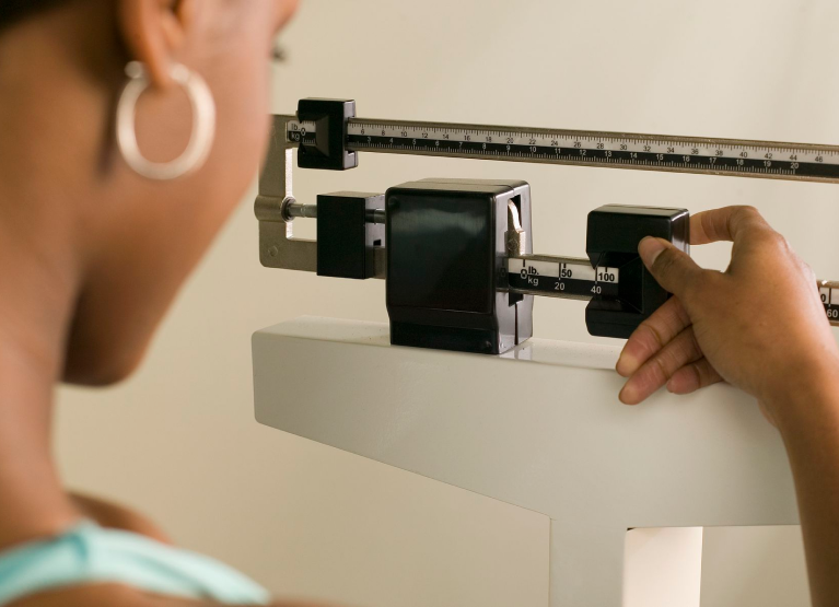 Person checking scale