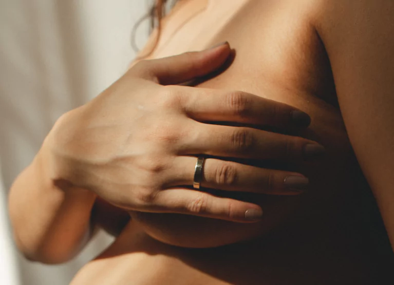 a woman holding her chest