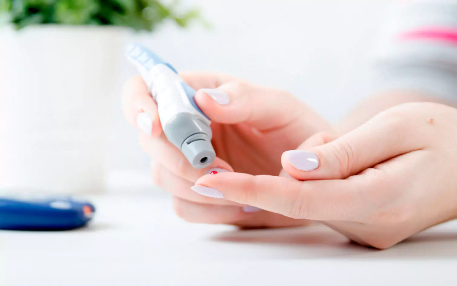 someone testing blood sugar
