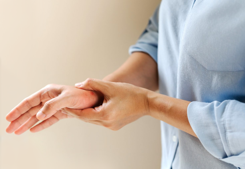 Person clutching joint in pain