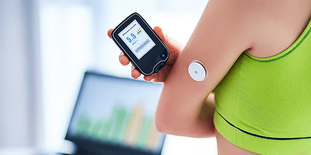 a person checking their glucose level
