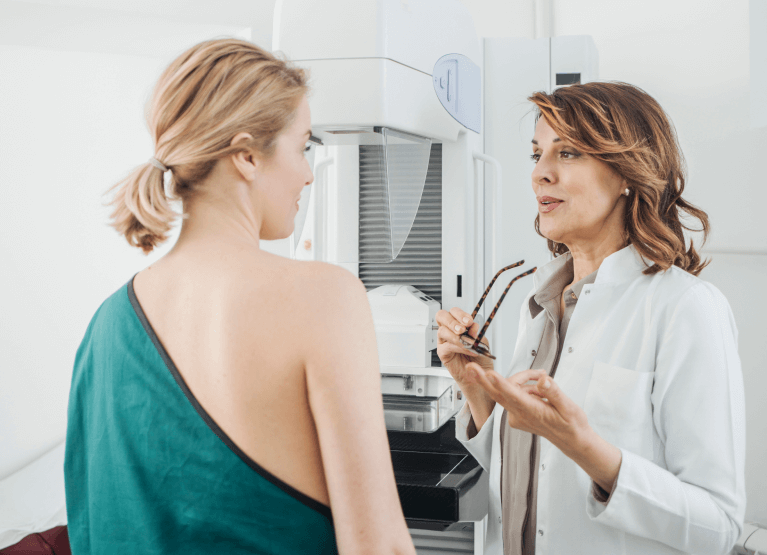 a woman speaking with her doctor