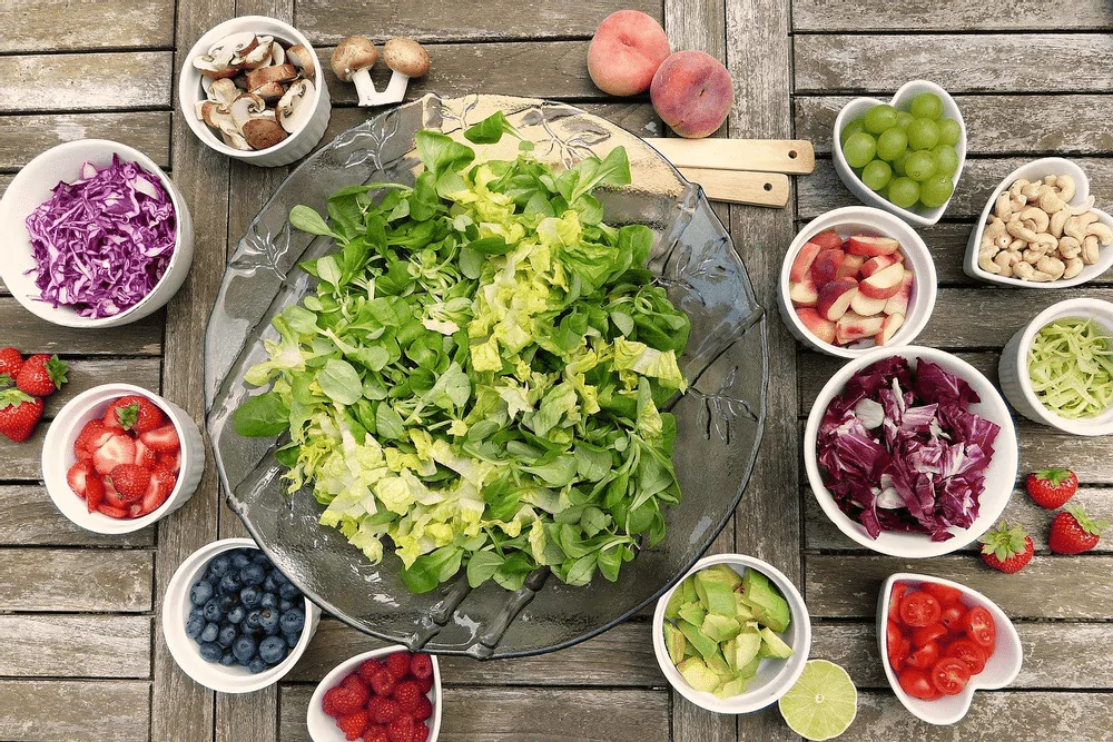 bowls of salsa, mushrooms, berries, fruits