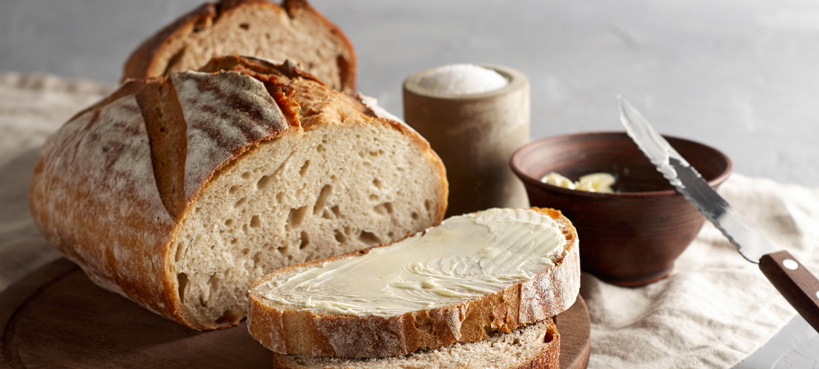 a loaf of bread with a slice cut