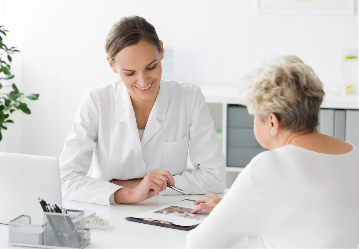 Doctor talking to patient in her office