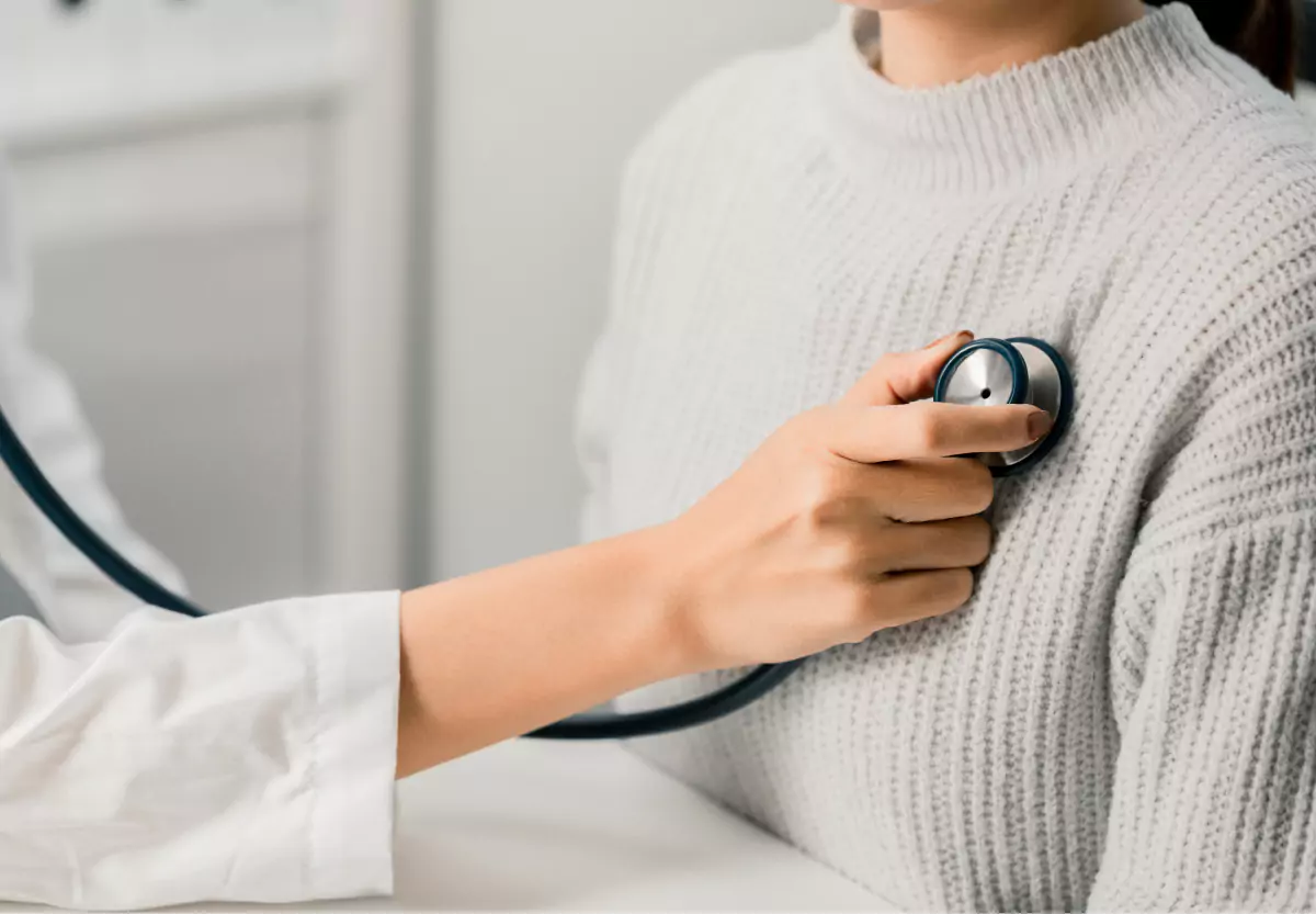Doctor auscultating patient's heart