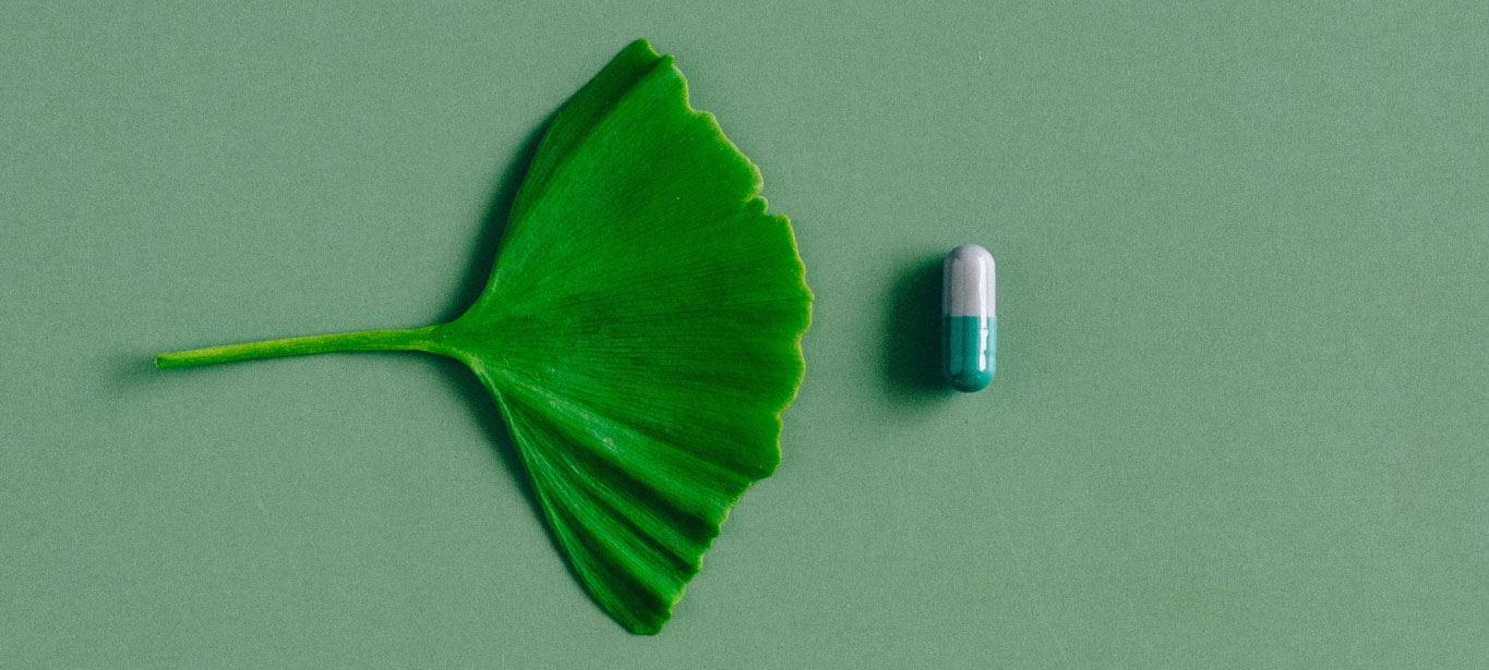 a leaf and a tablet of vitamin b12