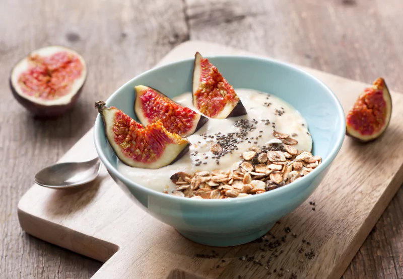 a bowl of nutritious oatmeal with figs