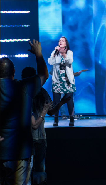Woman singing in worship