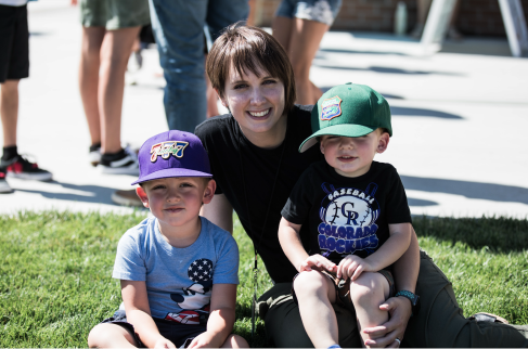 Woman holding two kids