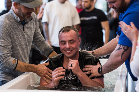 Man rejoicing in baptism