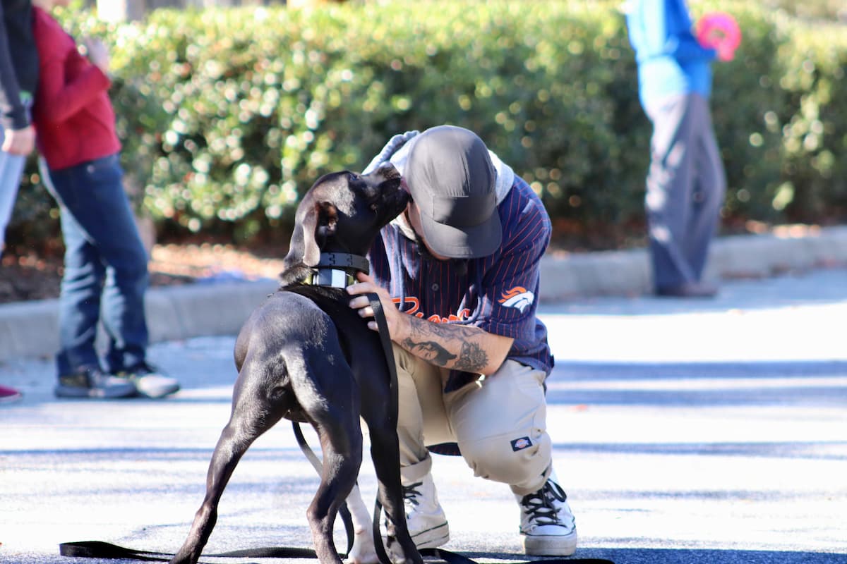 PepeDogs trainer embracing a dog during training