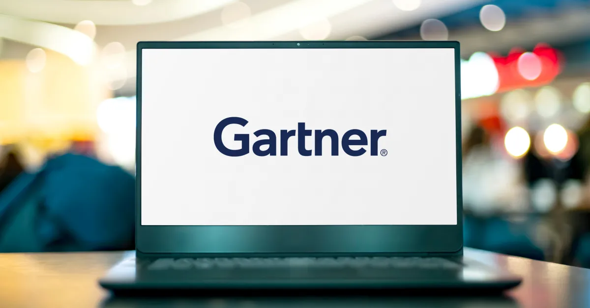 Laptop on desk with Gartner logo centered on display.
