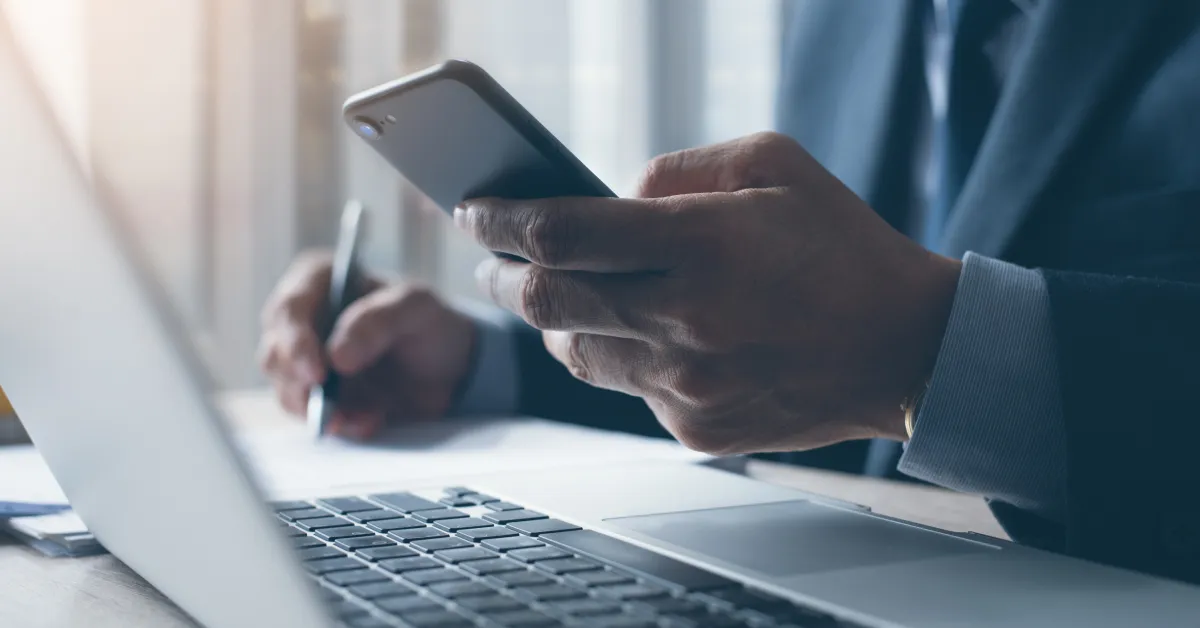 Lawyer sitting in office working on smartphone.