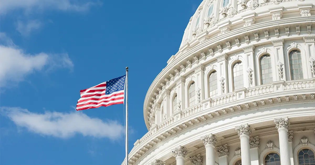 American flag in front of the White House.
