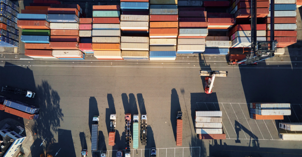 Container warehouse showing trucks and shipping containers