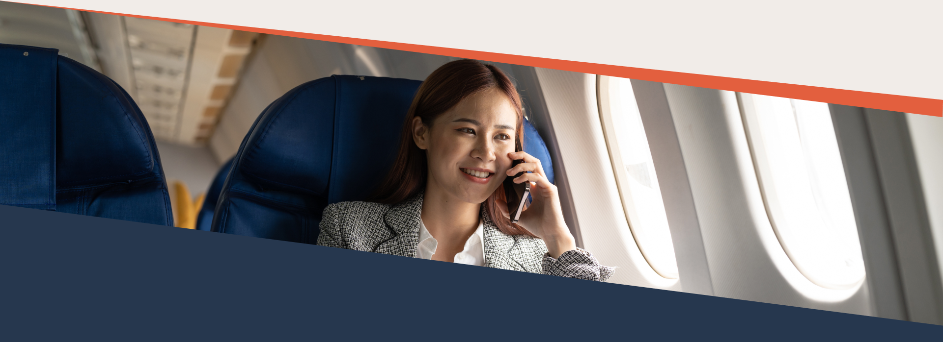 Woman in the plane on her phone