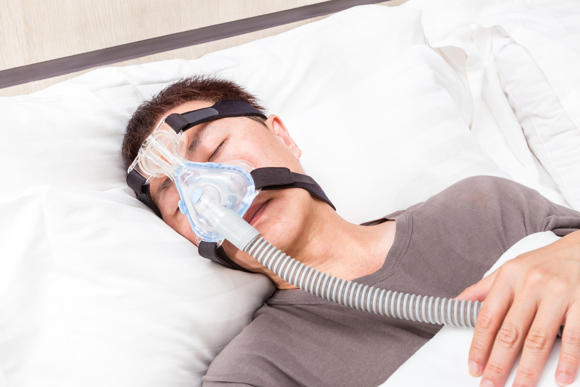 man with Sleep Apnea Kissimmee wearing CPAP machine