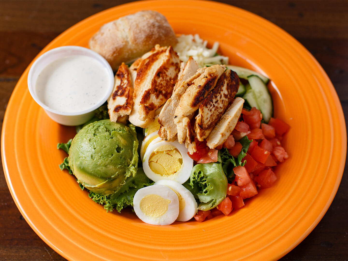 Cobb salad in orange dish