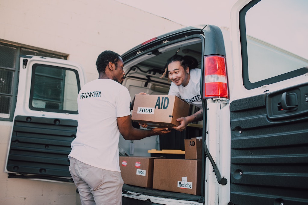 Photo of volunteers loading a truck