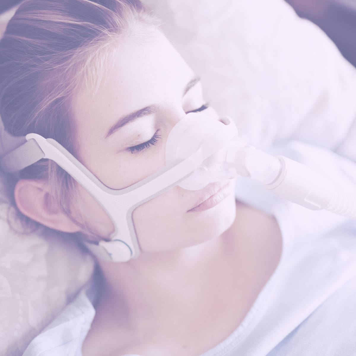 Woman wearing CPAP mask