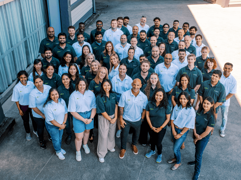 Photograph of Xref team in branded green and white shirts