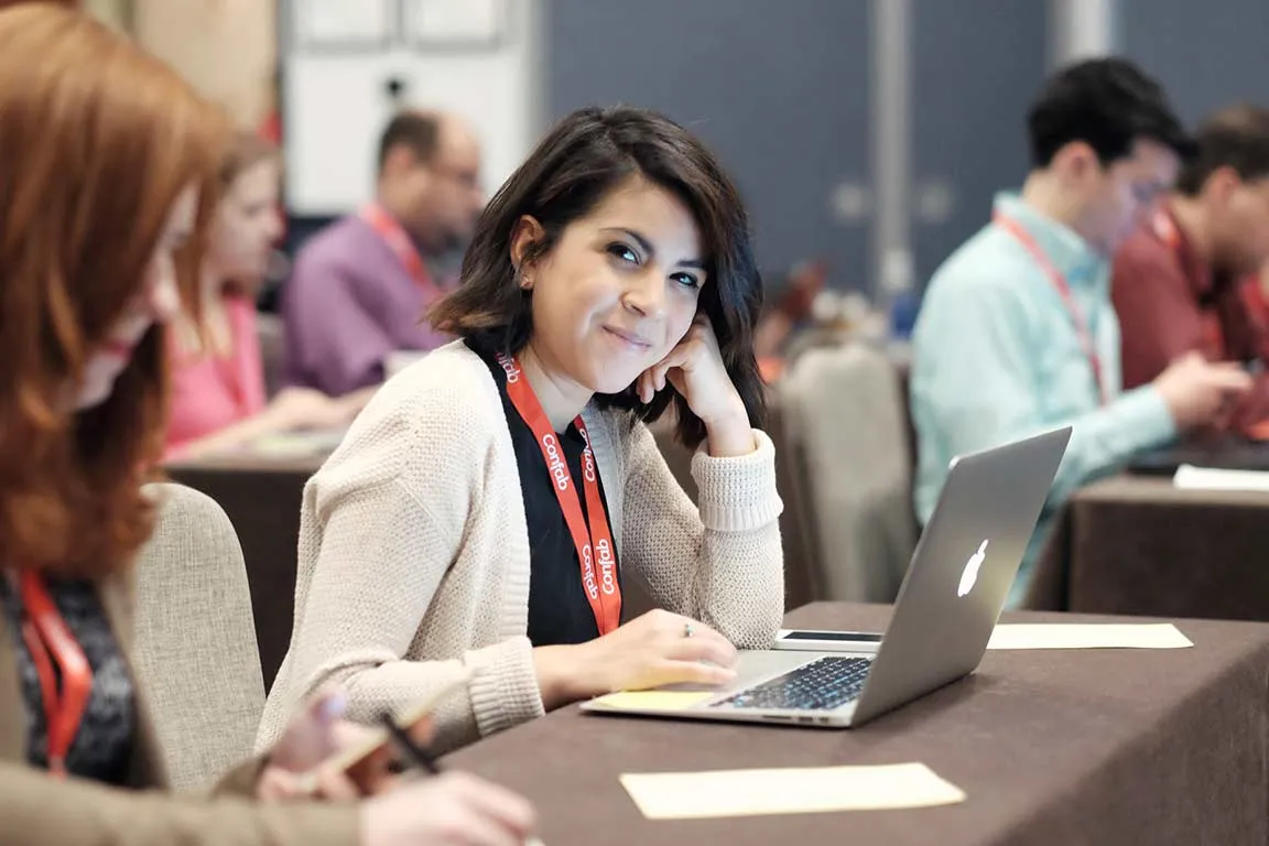 Photo of a woman looking at the camera and smiling during Confab