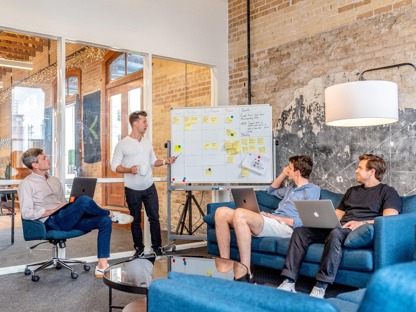 A group of people sitting in a roomDescription automatically generated